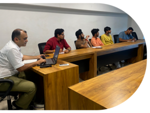 IT experts collaborating to deliver innovative solutions across industries, showcasing the company's commitment to IT innovation.