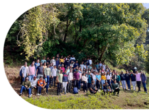 A diverse group of employees at one of the best IT company in Surat, smiling together at the picnic showcasing company culture.